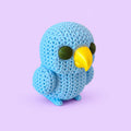 Papagaio no estilo tricô - amigurumi com fundo lavanda