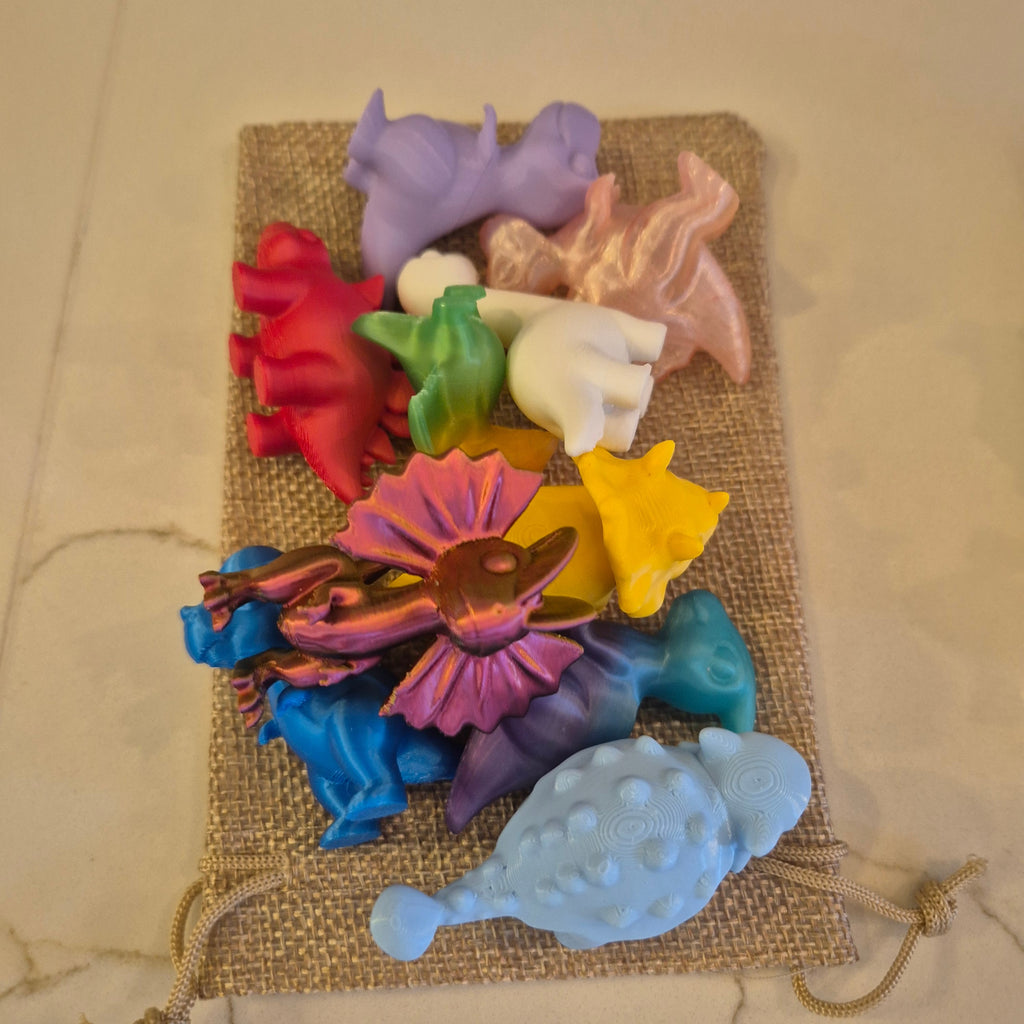 Kit de 11 mini dinossauros coloridos da Minha loja, feitos em plástico, ideais para decoração e lembrancinhas.